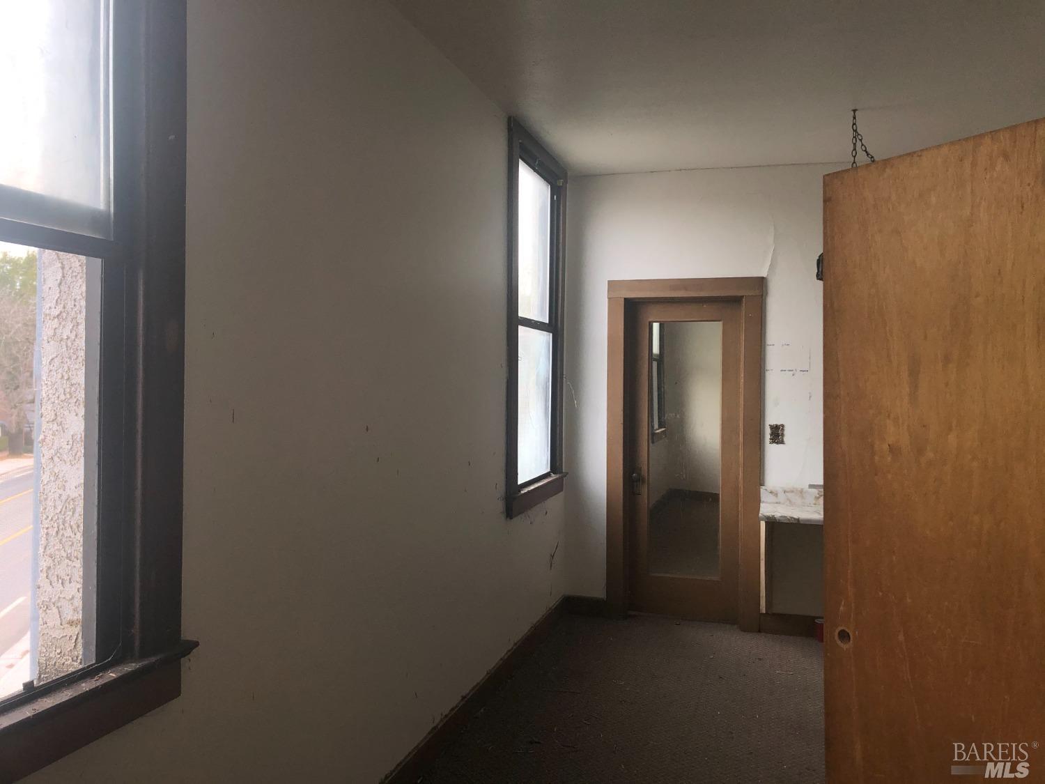 330 South Main Street Willits, CA 95490 - Photo 5 of 16 an empty room with windows