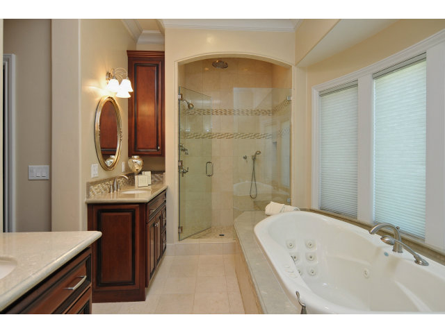 650 Covington Road Los Altos, CA 94024 - Photo 13 of 24 a en suite bathroom with a double vanity sink a mirror and a shower