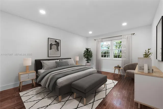 a bedroom with a bed and a table