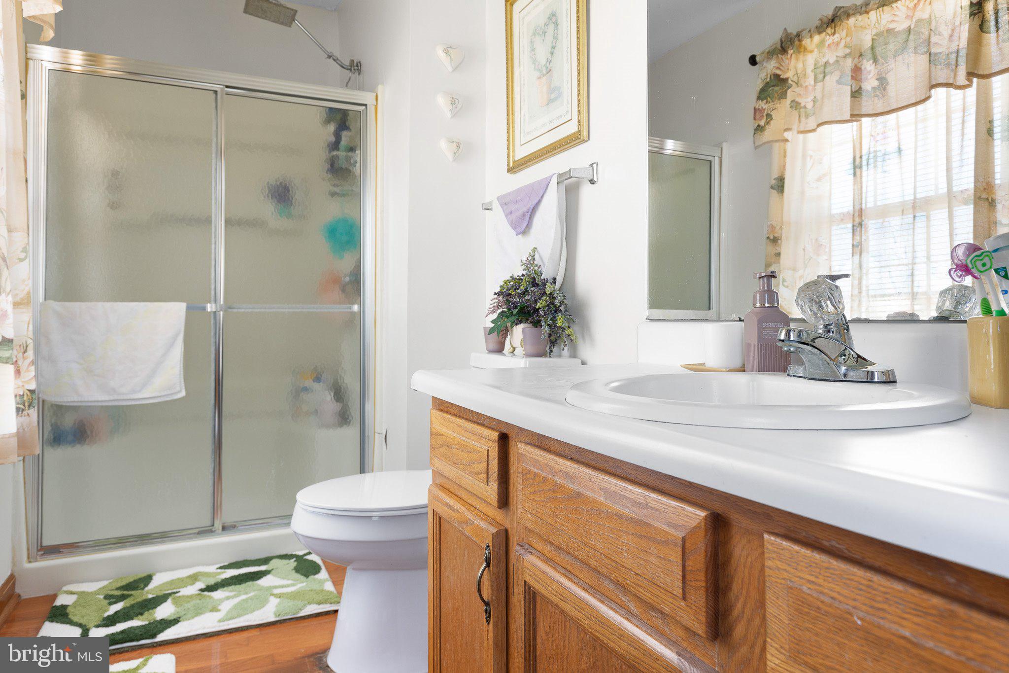 502 Mason Drive New Castle, DE 19720 - Photo 14 of 17 a bathroom with a sink and mirror with toilet