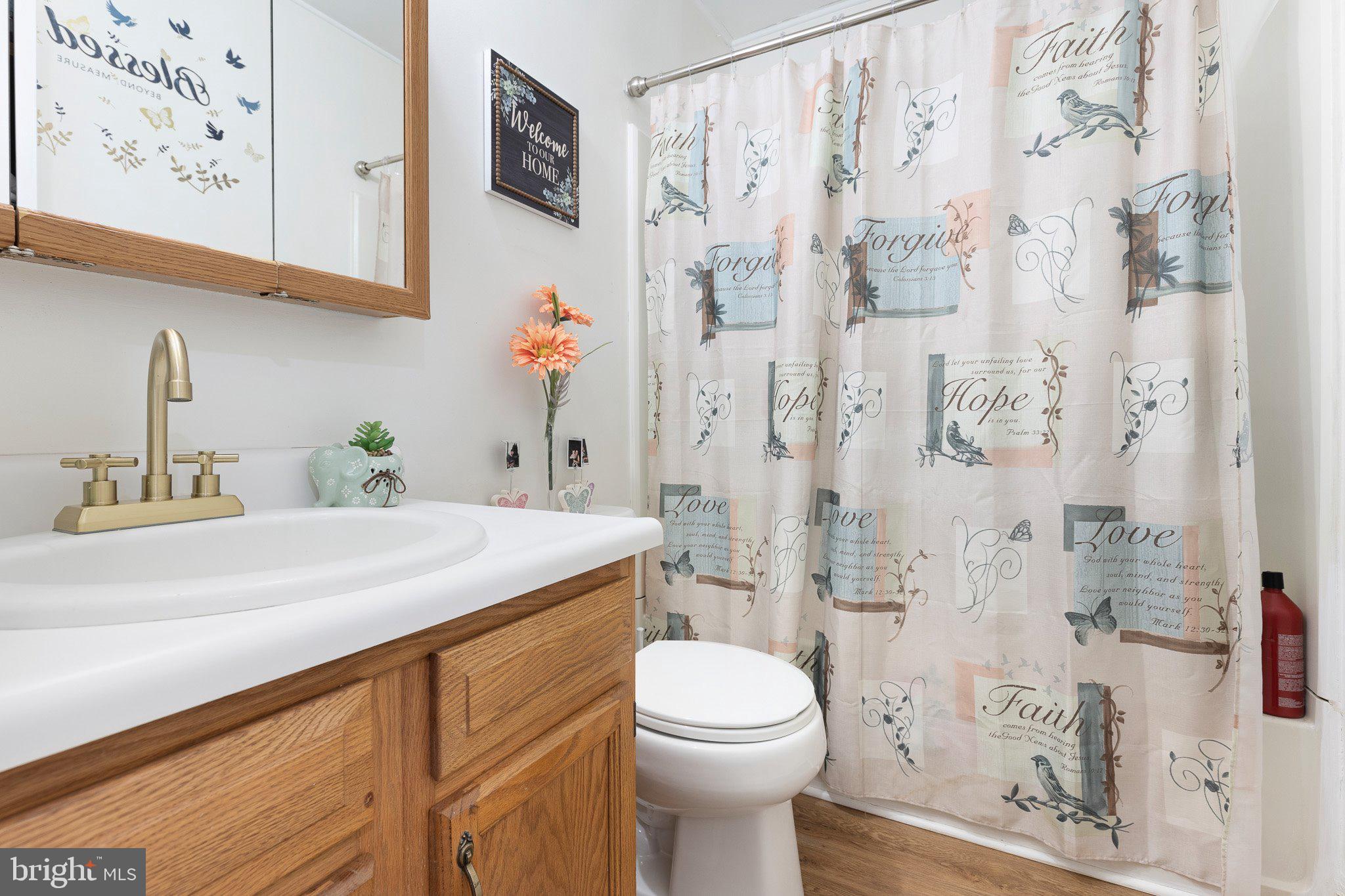 502 Mason Drive New Castle, DE 19720 - Photo 16 of 17 a bathroom with a sink toilet and shower