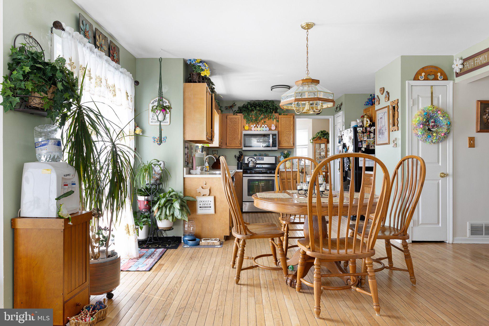 502 Mason Drive New Castle, DE 19720 - Photo 5 of 17 a view of a dining room with furniture window and wooden floor