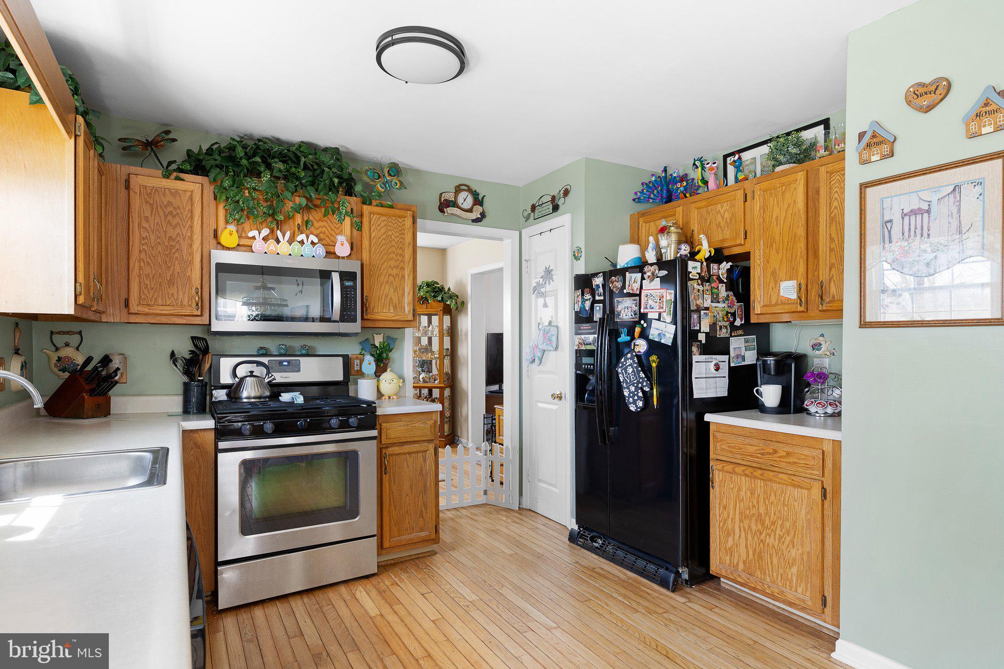 502 Mason Drive New Castle, DE 19720 - Photo 6 of 17 a kitchen with stainless steel appliances granite countertop a refrigerator a stove top oven a sink and dishwasher