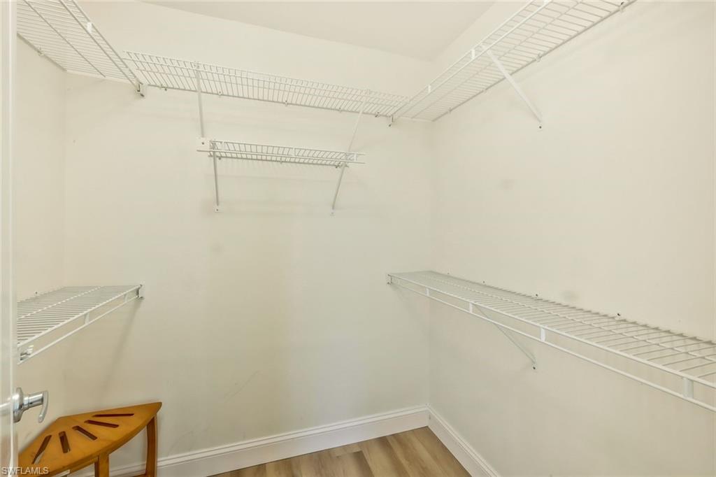 15350 Wimborne Lane, Unit 2 Naples, FL 34110 - Photo 20 of 42 a view of a room with racks on the wall