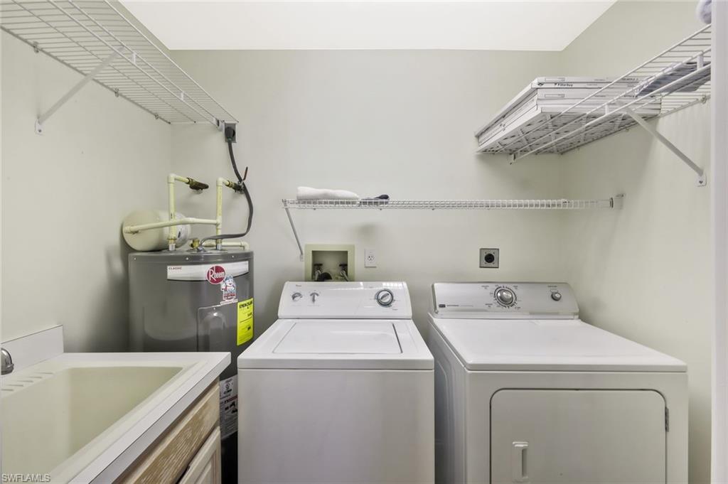 15350 Wimborne Lane, Unit 2 Naples, FL 34110 - Photo 28 of 42 a utility room with dryer and washer