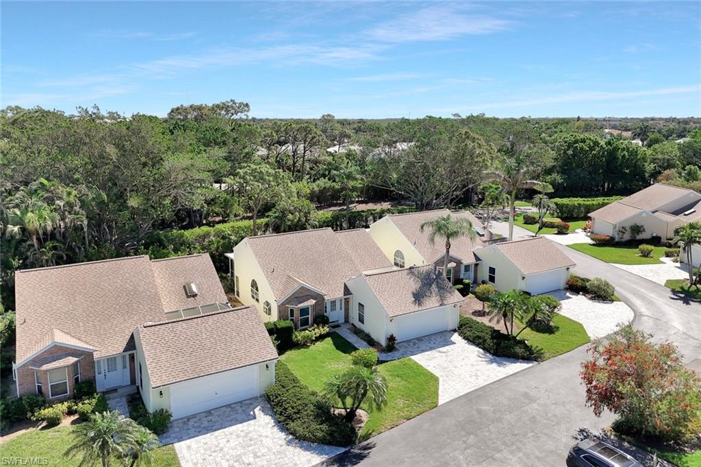15350 Wimborne Lane, Unit 2 Naples, FL 34110 - Photo 34 of 42 an aerial view of a house with a garden