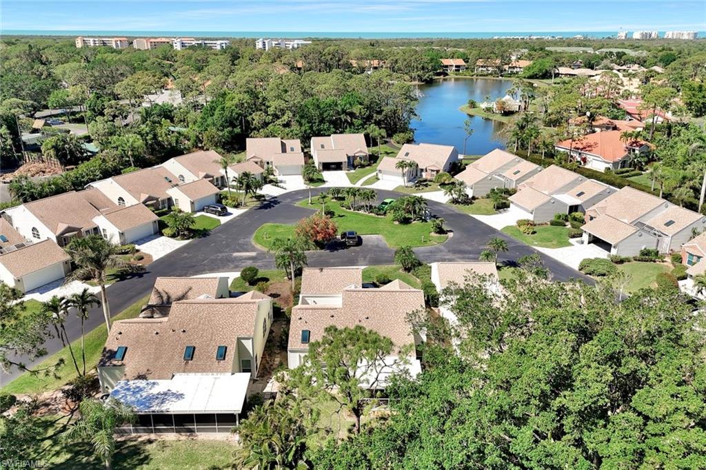 15350 Wimborne Lane, Unit 2 Naples, FL 34110 - Photo 35 of 42 an aerial view of a house with a lake view