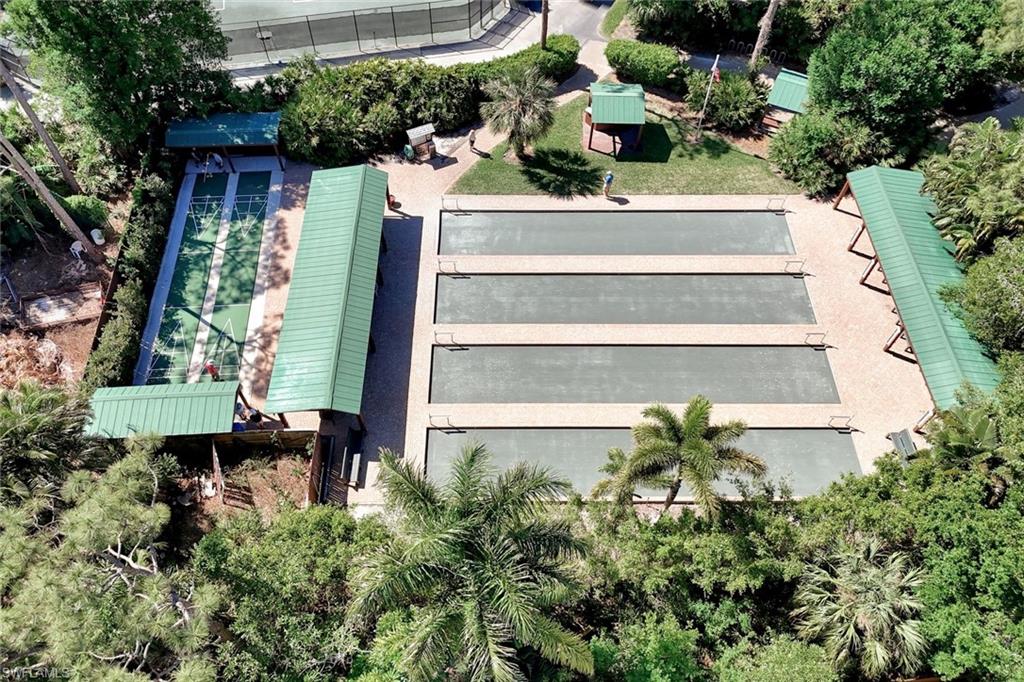 15350 Wimborne Lane, Unit 2 Naples, FL 34110 - Photo 39 of 42 a view of a house with a yard and potted plants