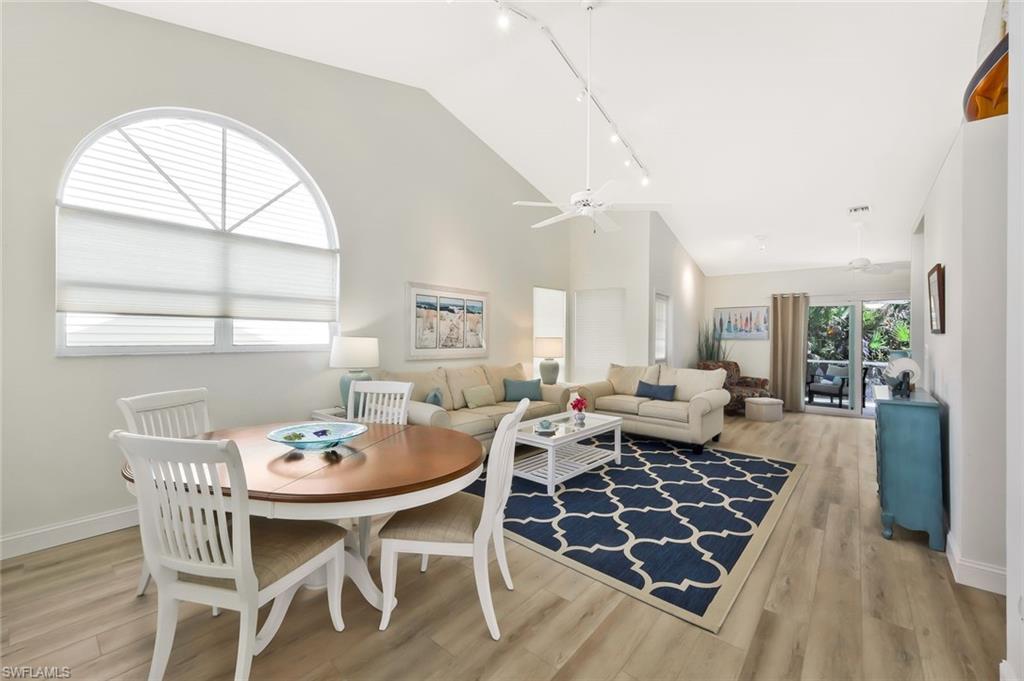 15350 Wimborne Lane, Unit 2 Naples, FL 34110 - Photo 8 of 42 a view of a dining room and livingroom with furniture