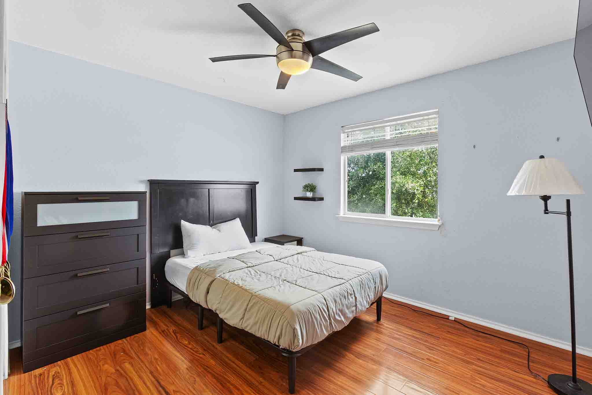 270 Endeavour Kyle, TX 78640 - Photo 15 of 20 This room features wood flooring, a window offering natural light, and a ceiling fan