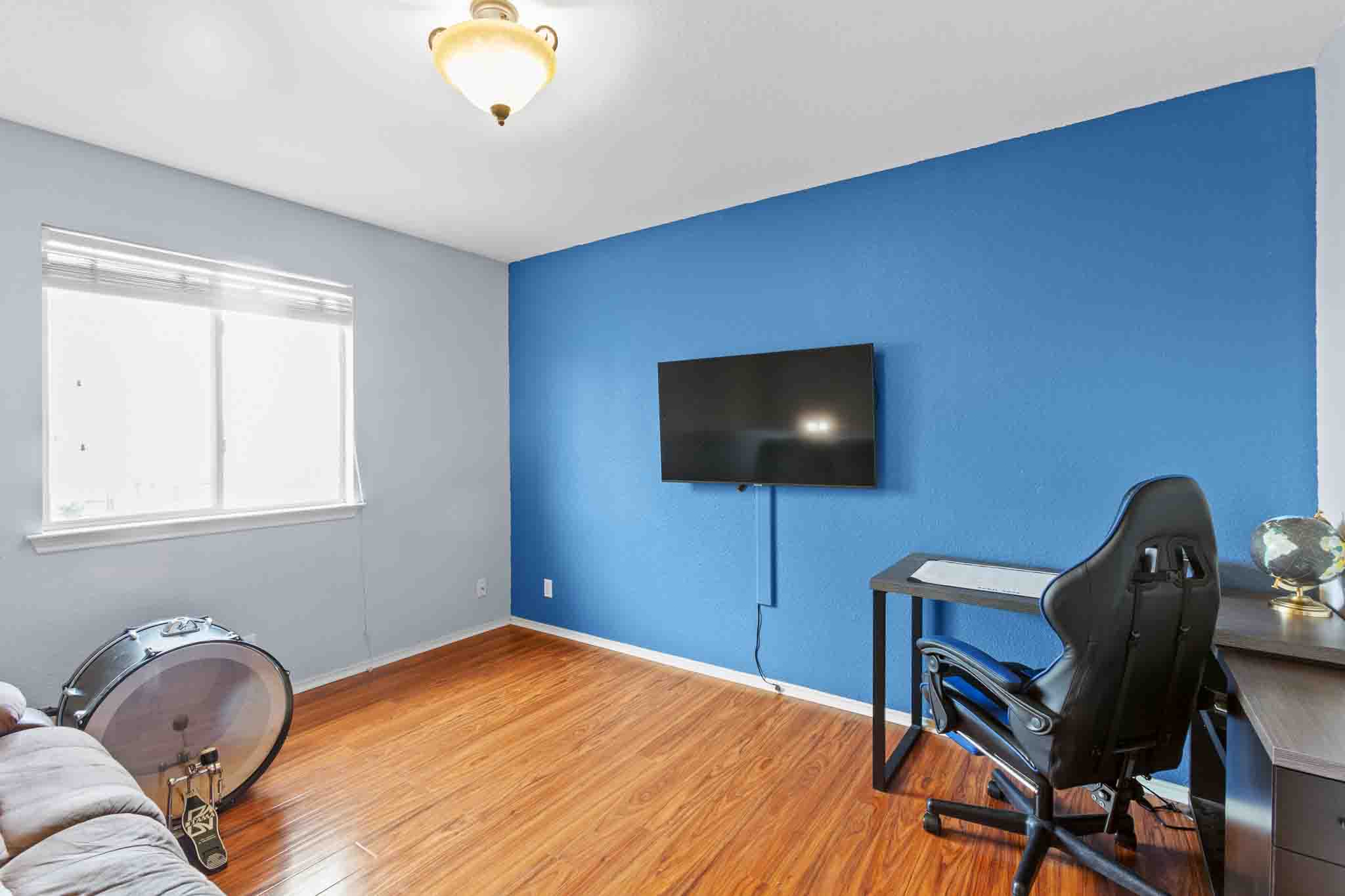 270 Endeavour Kyle, TX 78640 - Photo 16 of 20 This room features hardwood flooring, a window providing natural light, and a ceiling light fixture