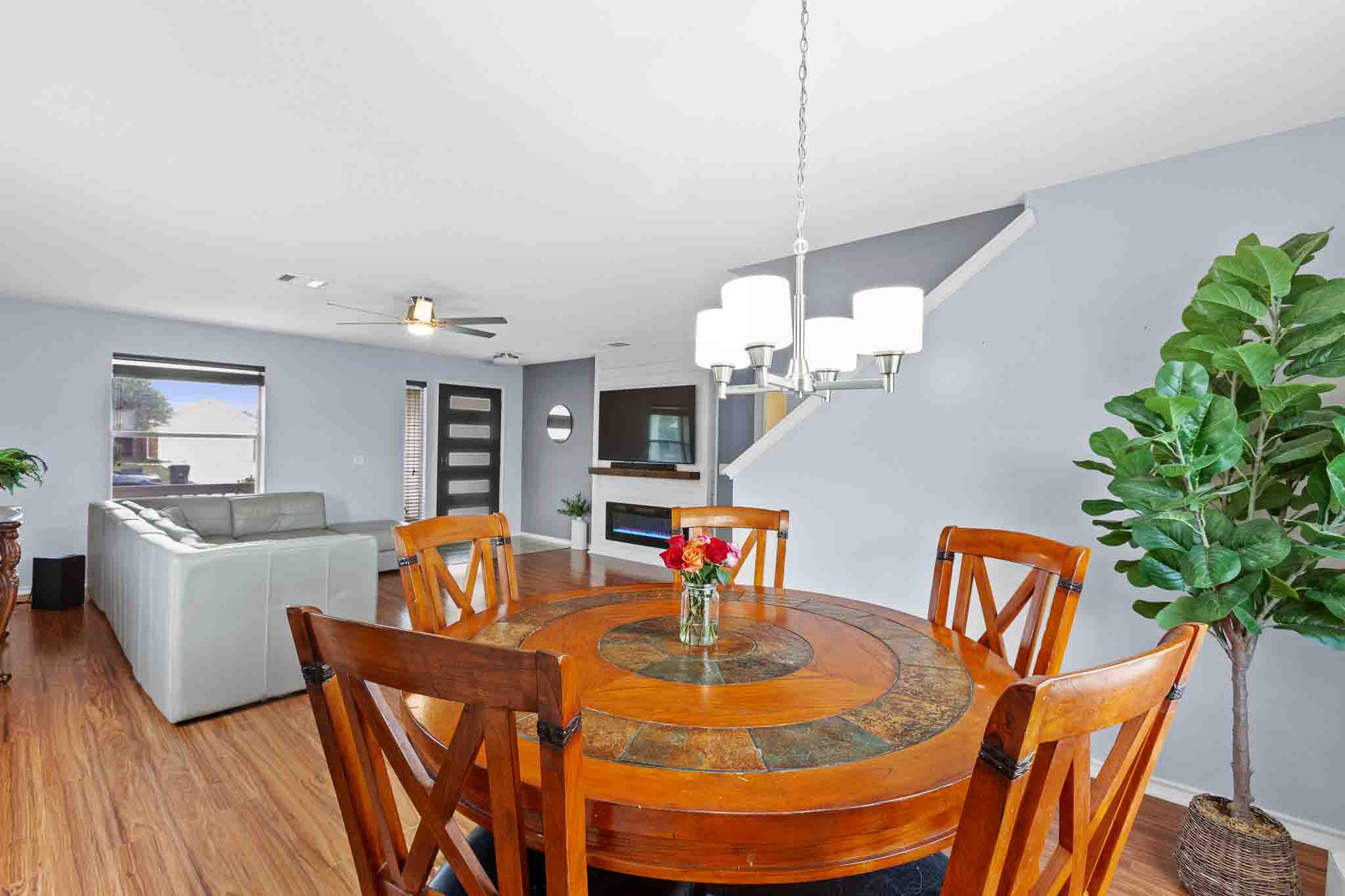 270 Endeavour Kyle, TX 78640 - Photo 6 of 20 This open-concept living area features hardwood floors, a modern ceiling fan, and a fireplace with a mantel