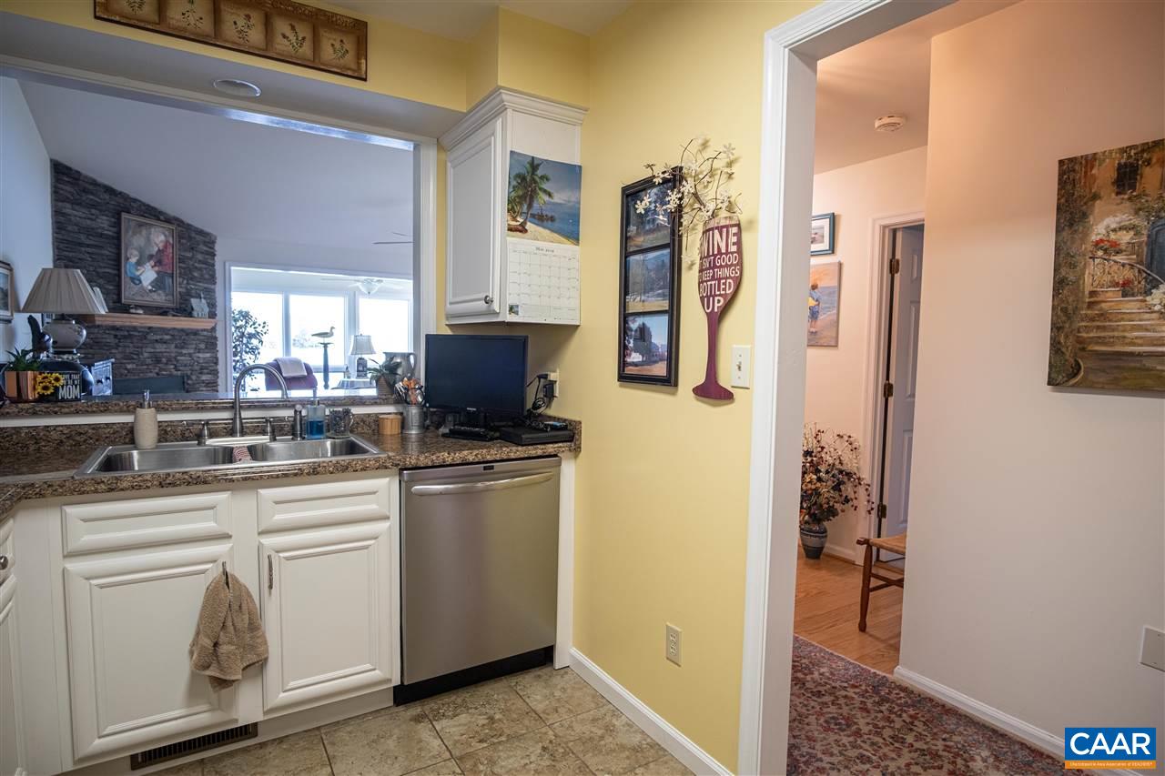 1 Marina Point, Unit B1 Palmyra, VA 22963 - Photo 11 of 31 a kitchen with stainless steel appliances granite countertop a refrigerator and a stove top oven