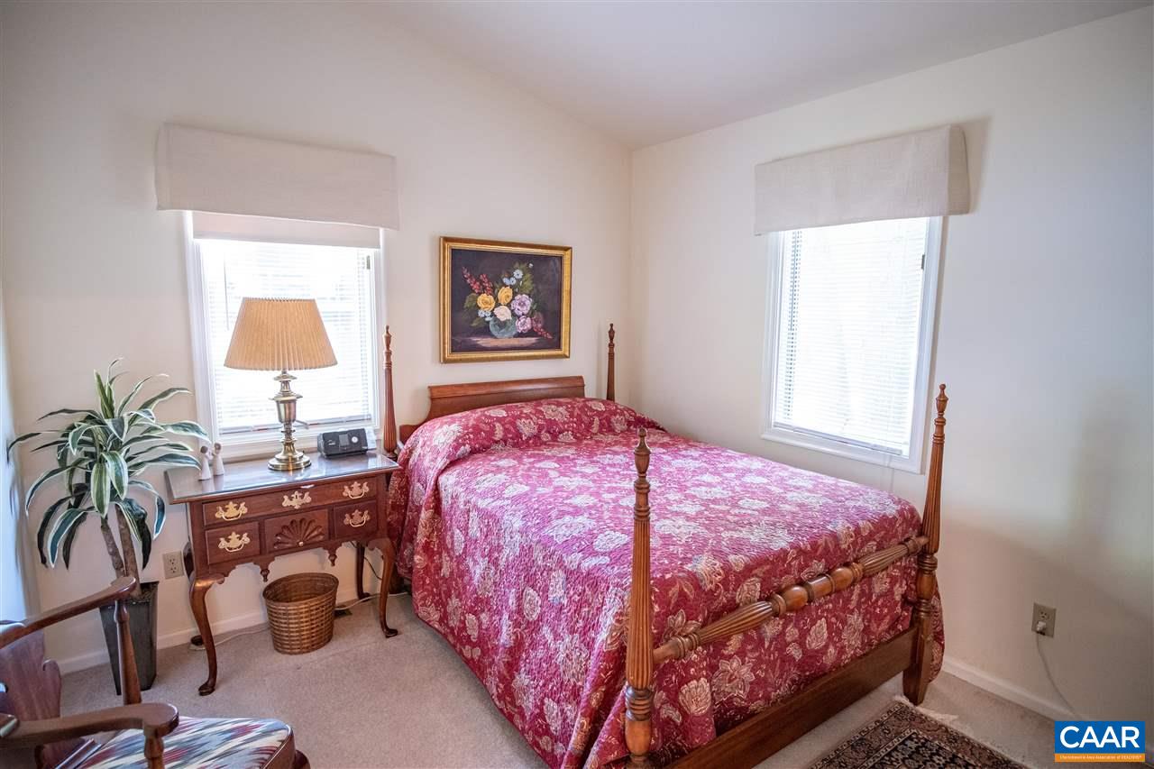 1 Marina Point, Unit B1 Palmyra, VA 22963 - Photo 16 of 31 a bedroom with a bed and wooden floor