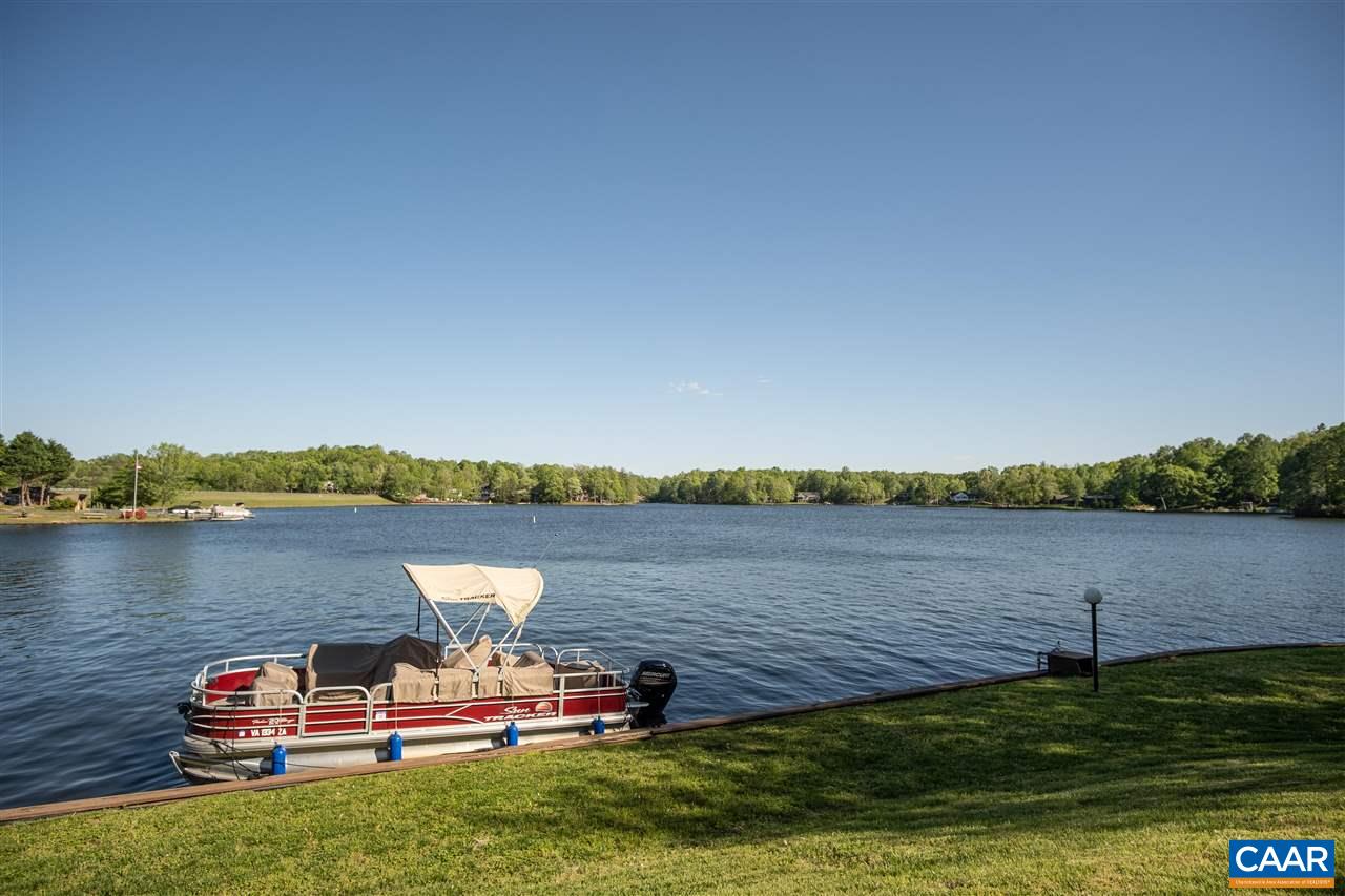 1 Marina Point, Unit B1 Palmyra, VA 22963 - Photo 4 of 31 a view of a lake with houses in the background