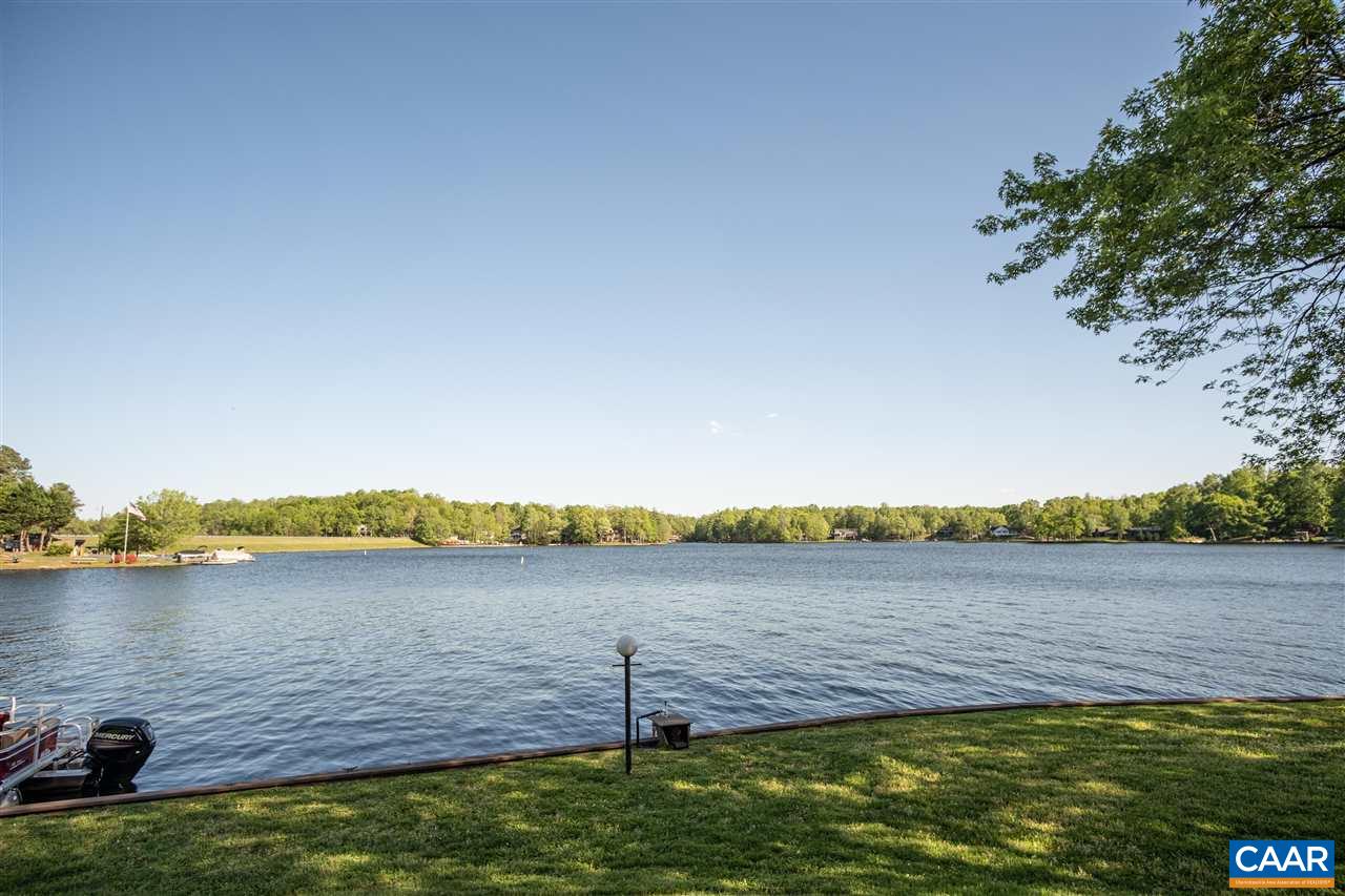 1 Marina Point, Unit B1 Palmyra, VA 22963 - Photo 5 of 31 a view of a lake with houses in the background