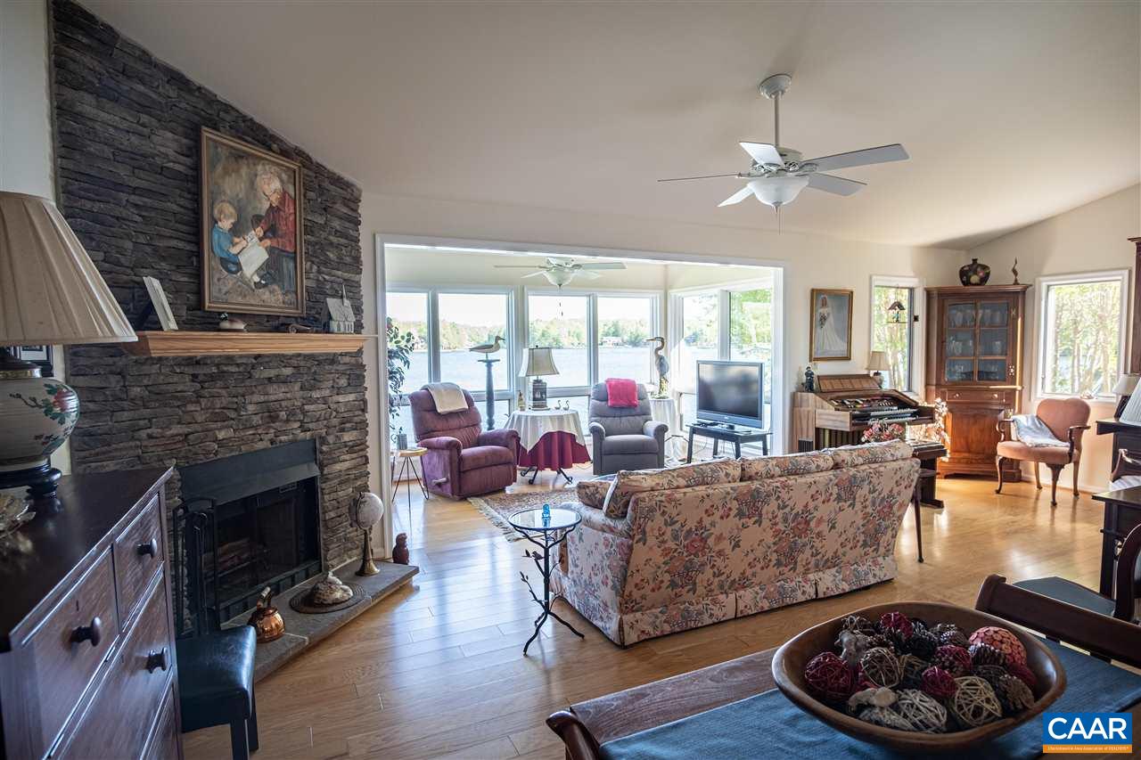 1 Marina Point, Unit B1 Palmyra, VA 22963 - Photo 7 of 31 a living room with furniture and a fireplace