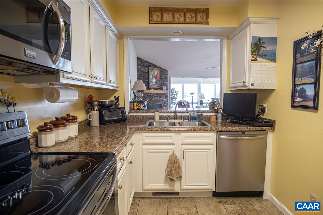 1 Marina Point, Unit B1 Palmyra, VA 22963 - Photo 10 of 31 a kitchen with stainless steel appliances granite countertop a stove and a sink