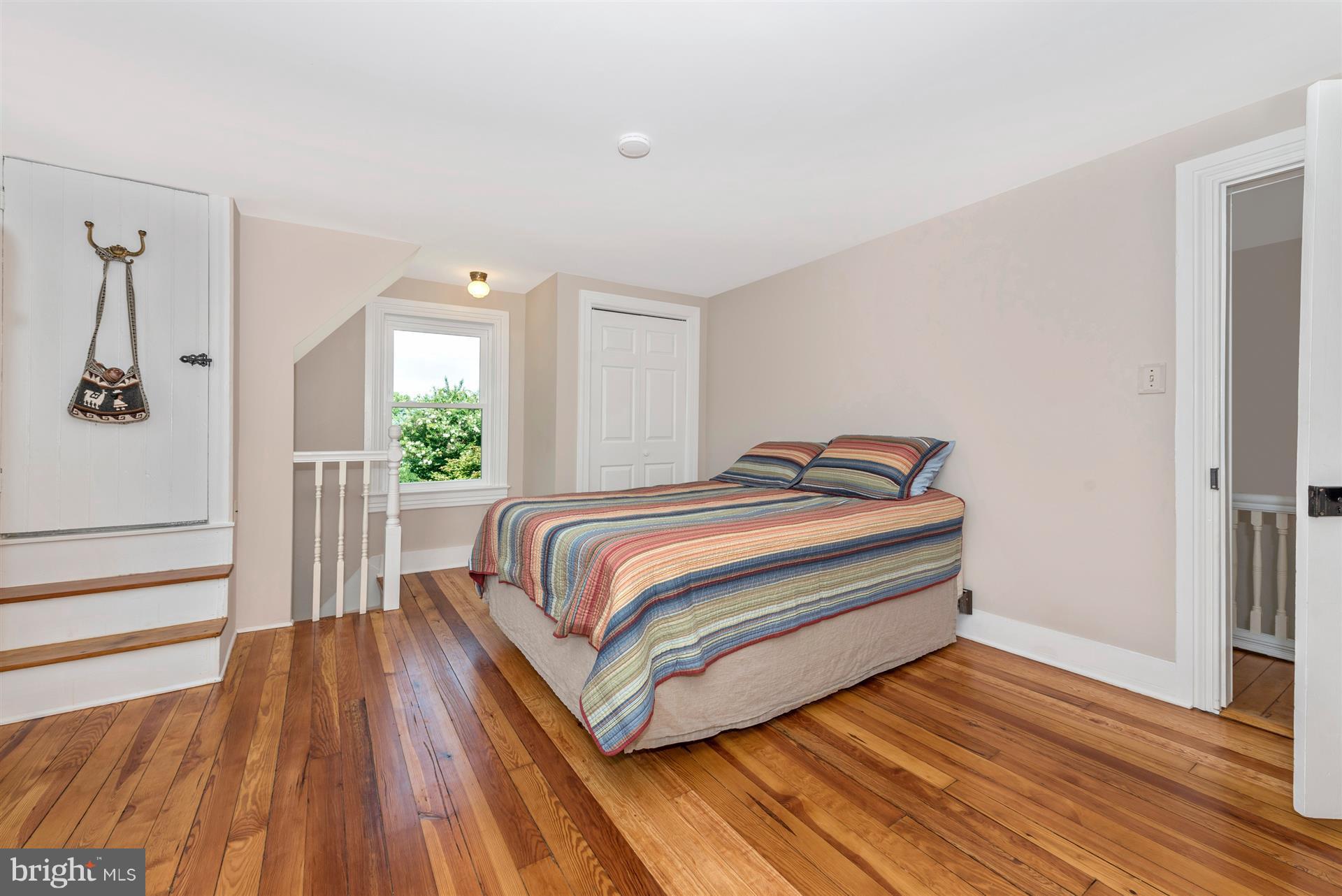 13616 Penn Shop Road Mount Airy, MD 21771 - Photo 22 of 30 a bedroom with a bed and wooden floor
