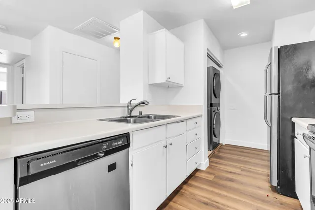a white bath tub sitting next to a white toilet and sink
