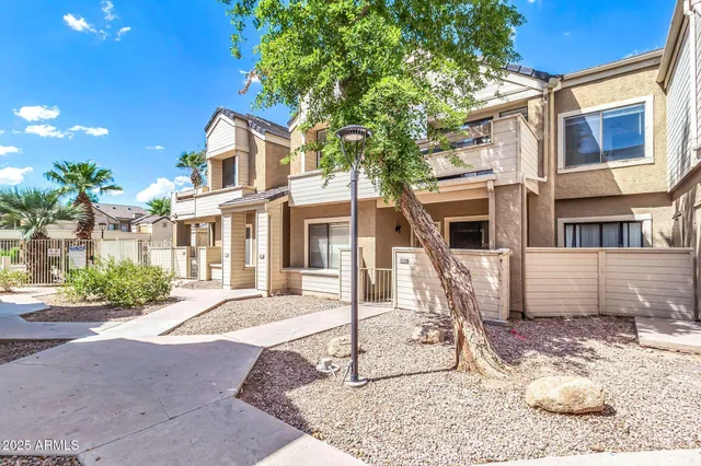 a view of kitchen with microwave and refrigerator