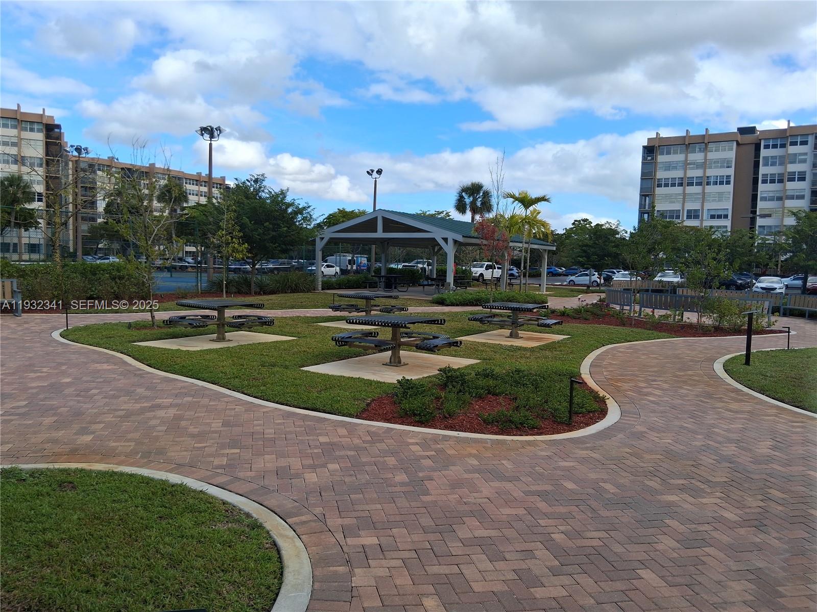1000 St Charles Place, Unit L2 Pembroke Pines, FL 33026 - Photo 14 of 16 a view of a fountain in front of a building
