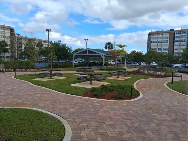 a view of a water with a multi story building in front of it