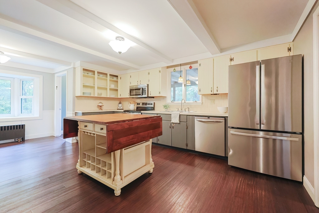 76 Ray Road Wrentham, MA 02093 - Photo 4 of 42 a kitchen with a refrigerator and a stove top oven