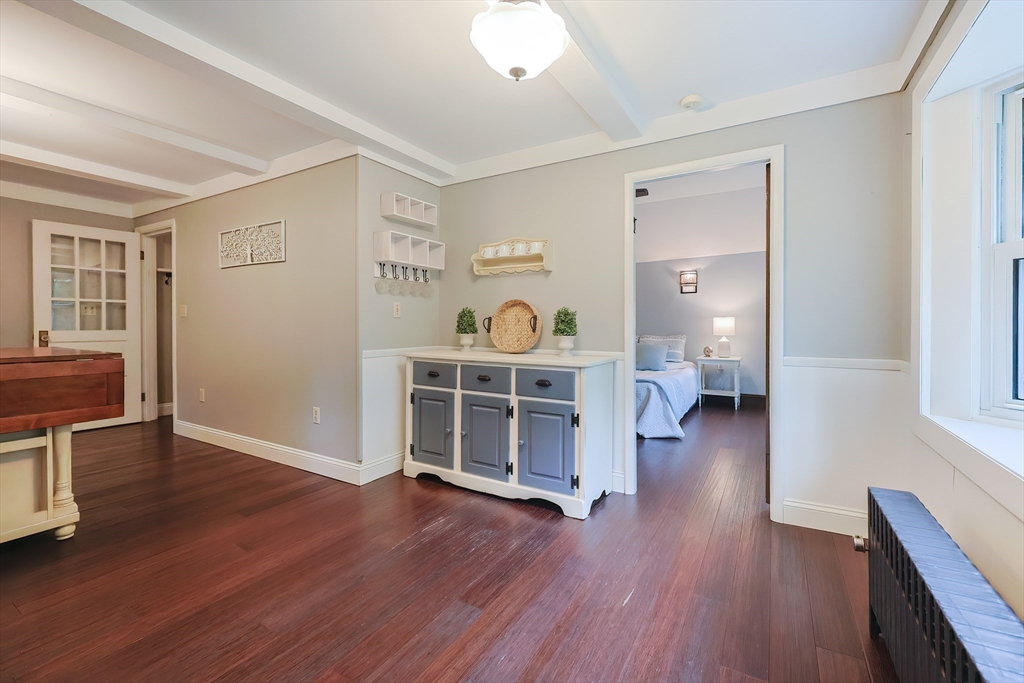76 Ray Road Wrentham, MA 02093 - Photo 10 of 42 a view of an empty room with a window and wooden floor