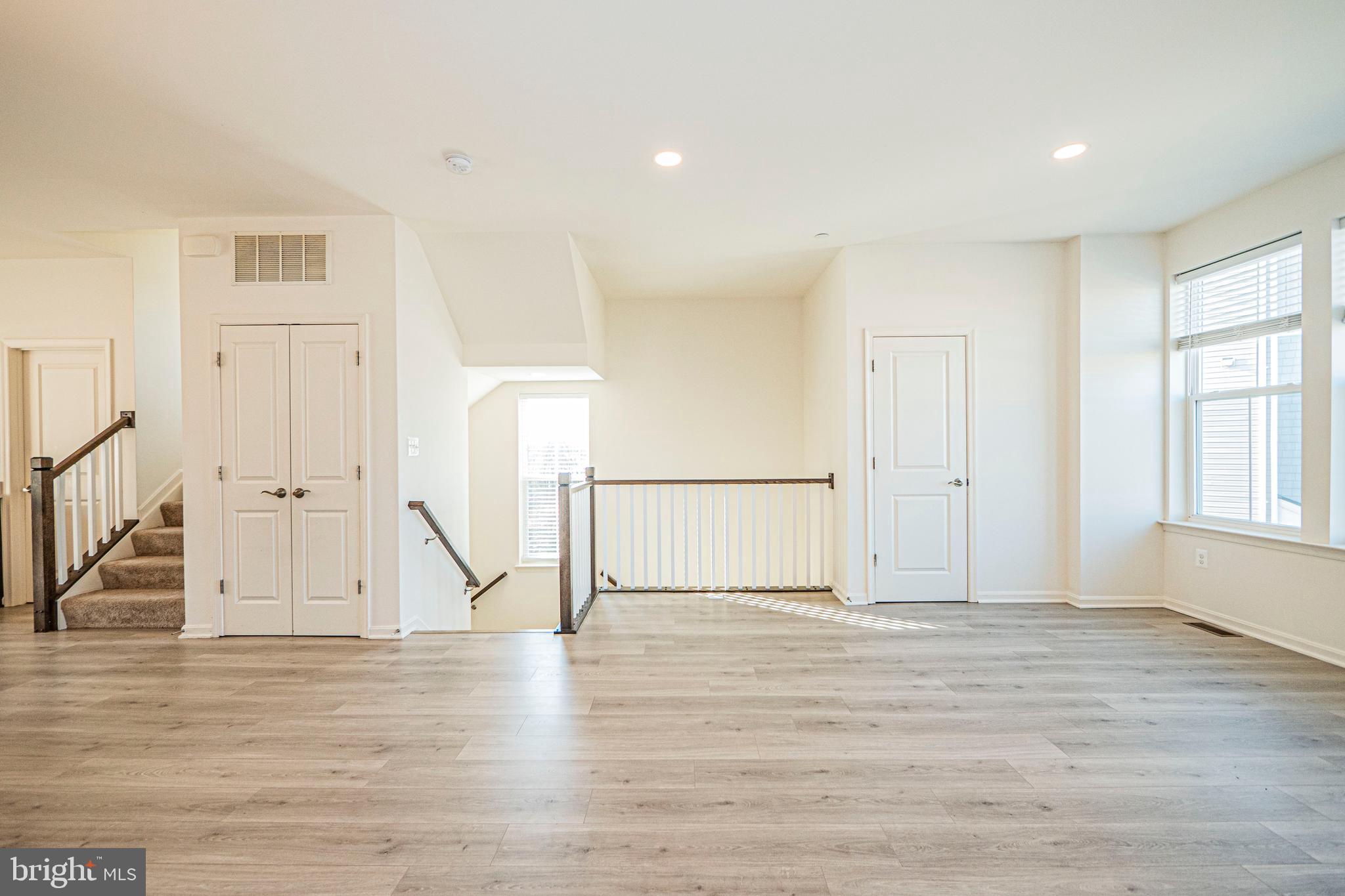 7315 Martin Farm Circle Rosedale, MD 21237 - Photo 13 of 46 a view of empty room with wooden floor