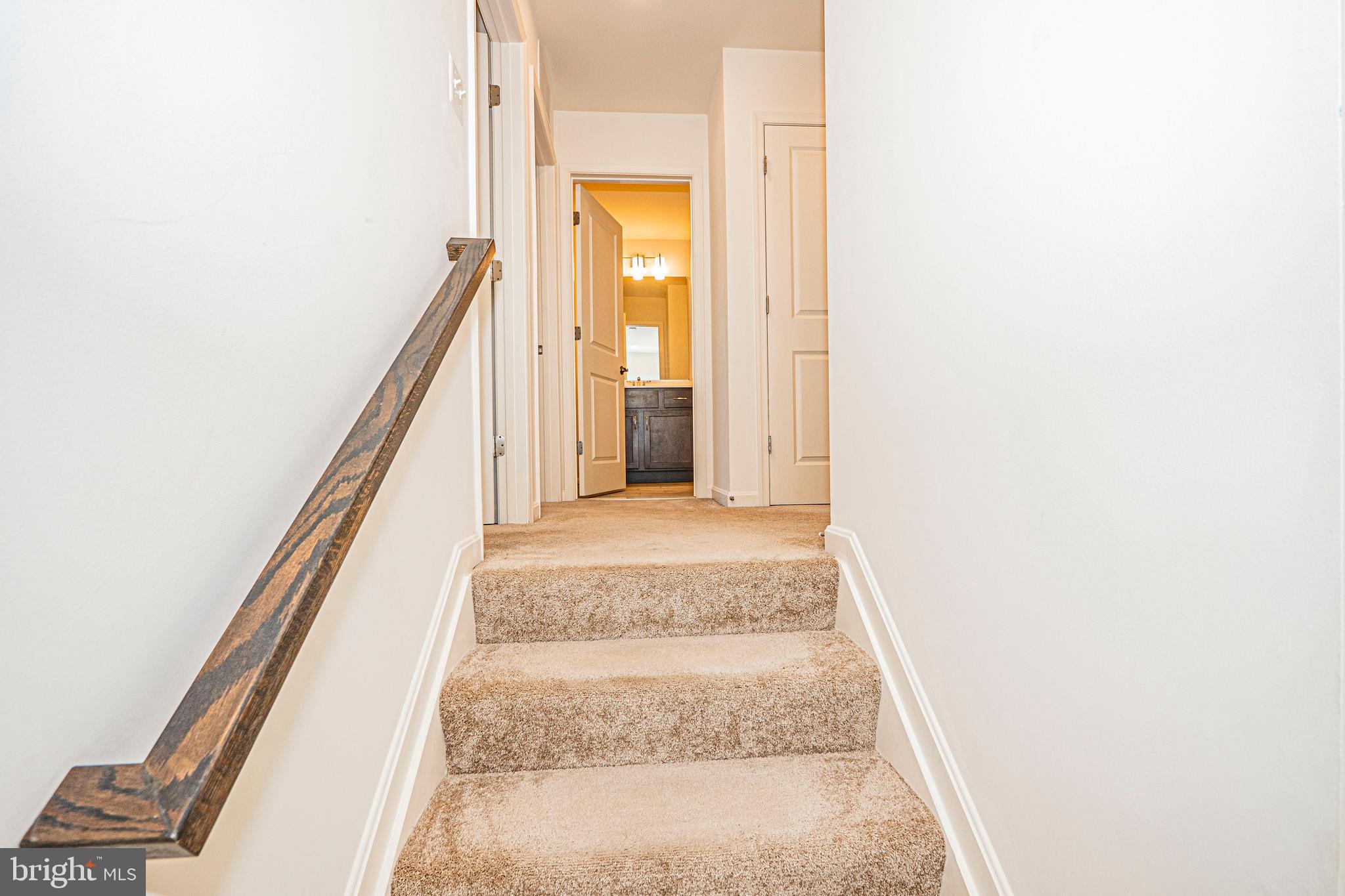 7315 Martin Farm Circle Rosedale, MD 21237 - Photo 28 of 46 a view of a hallway with wooden floor and staircase