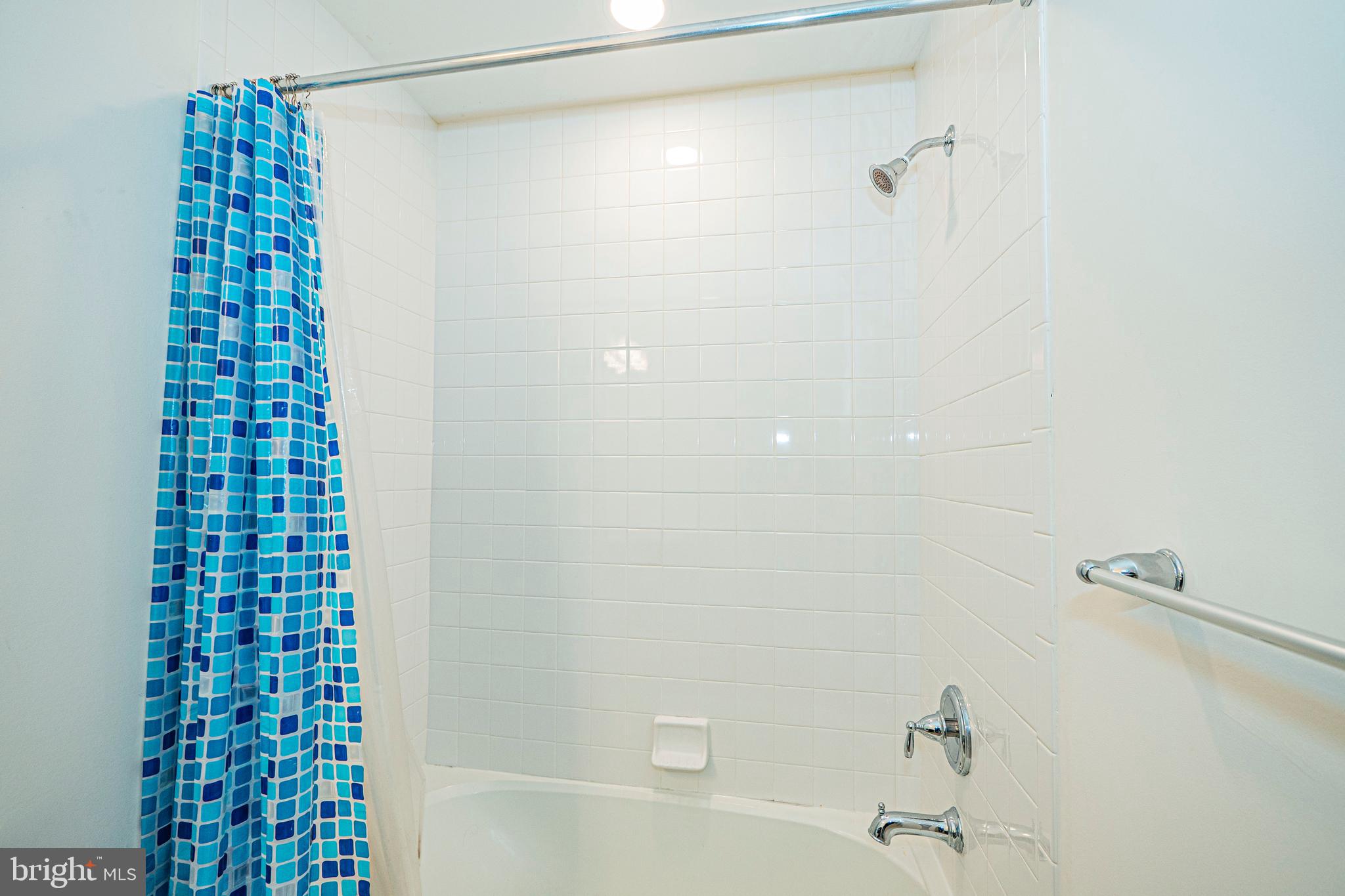 7315 Martin Farm Circle Rosedale, MD 21237 - Photo 30 of 46 a bathroom with a shower and a bathtub