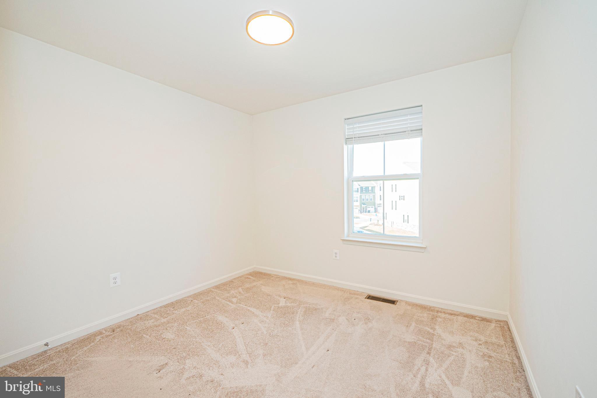 7315 Martin Farm Circle Rosedale, MD 21237 - Photo 31 of 46 an empty room with a window