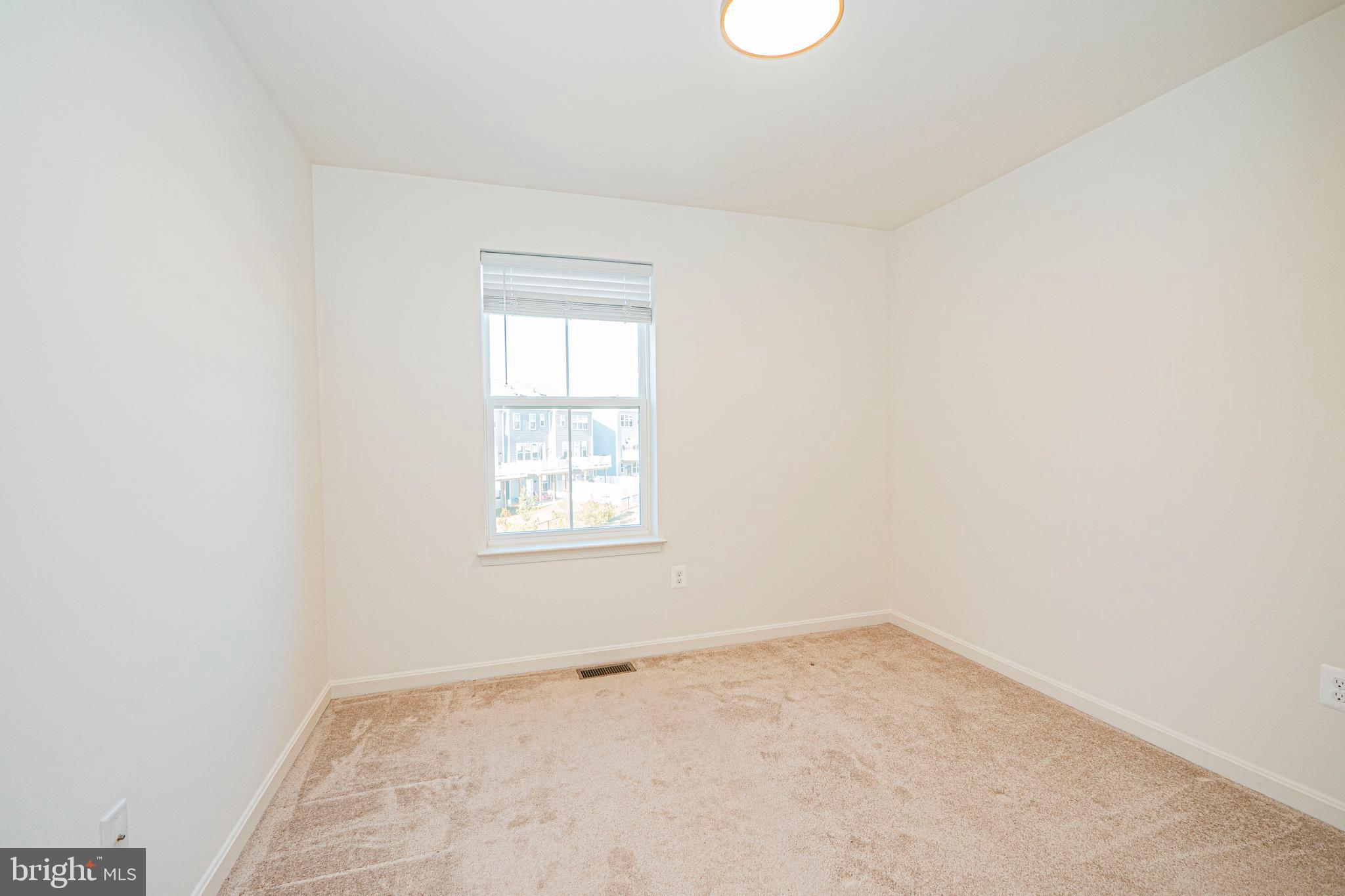 7315 Martin Farm Circle Rosedale, MD 21237 - Photo 33 of 46 an empty room with a window