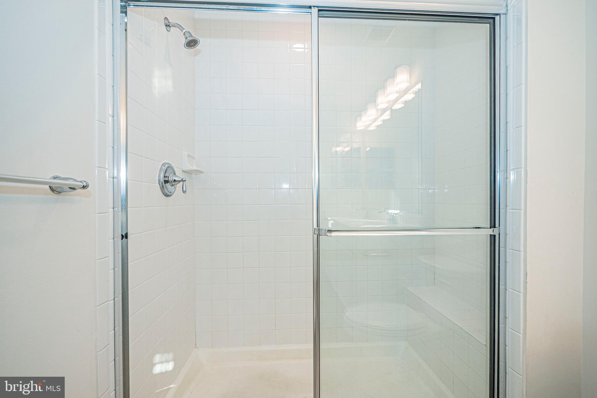 7315 Martin Farm Circle Rosedale, MD 21237 - Photo 40 of 46 a bathroom with a glass shower door