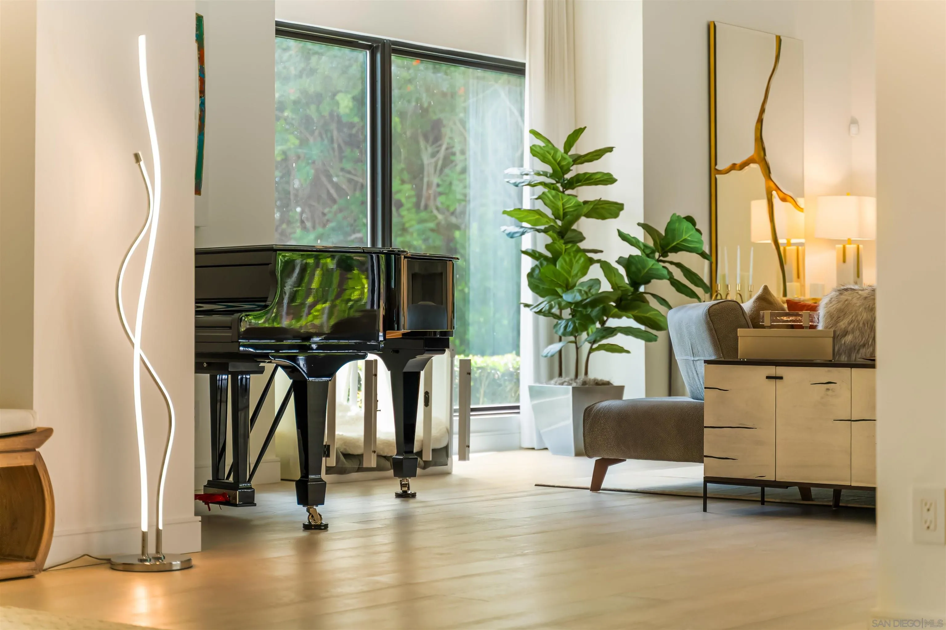 6887 Avenida Andorra La Jolla, CA 92037 - Photo 11 of 75 a living room with fireplace furniture and a potted plant
