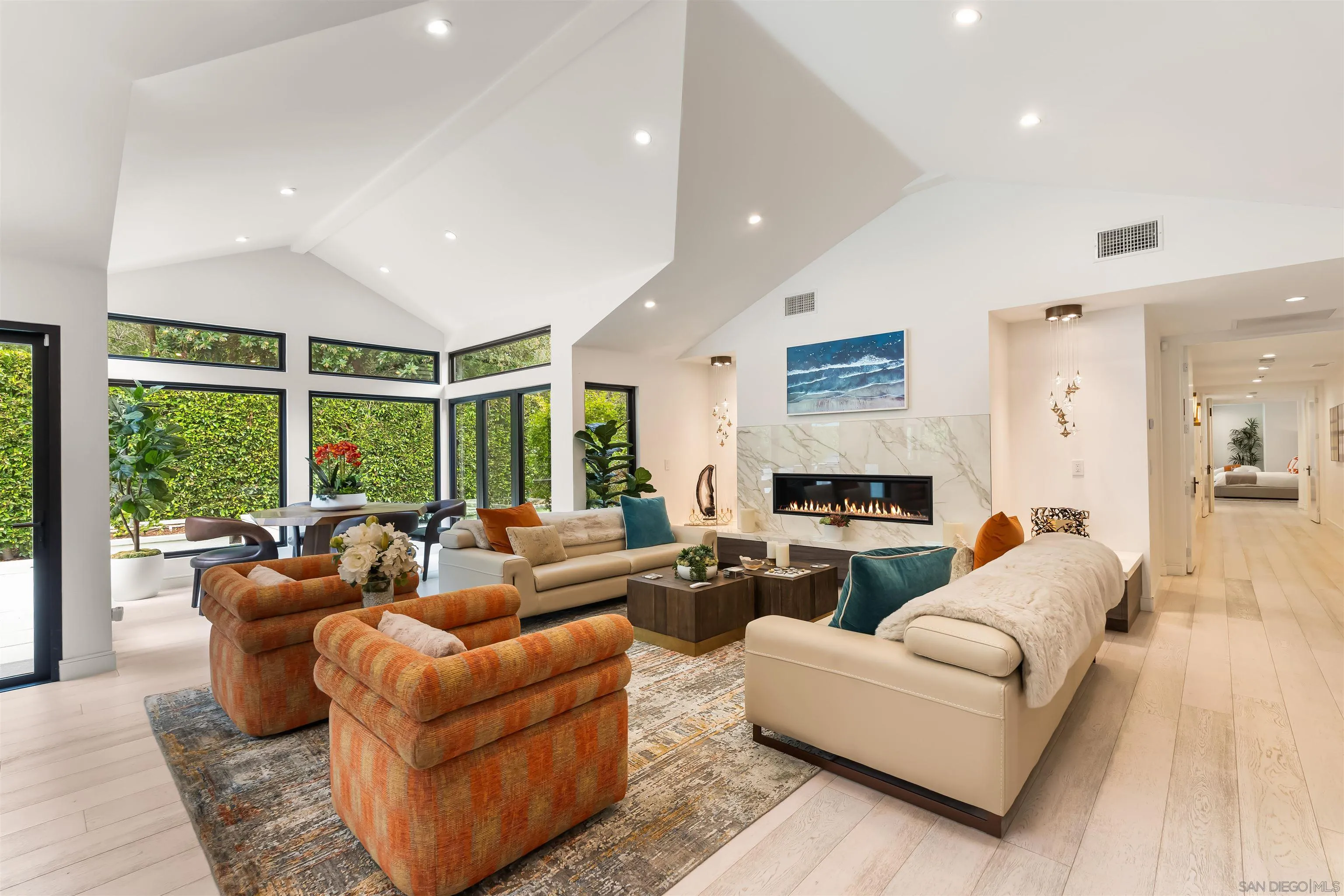 6887 Avenida Andorra La Jolla, CA 92037 - Photo 23 of 75 a living room with furniture and a large window