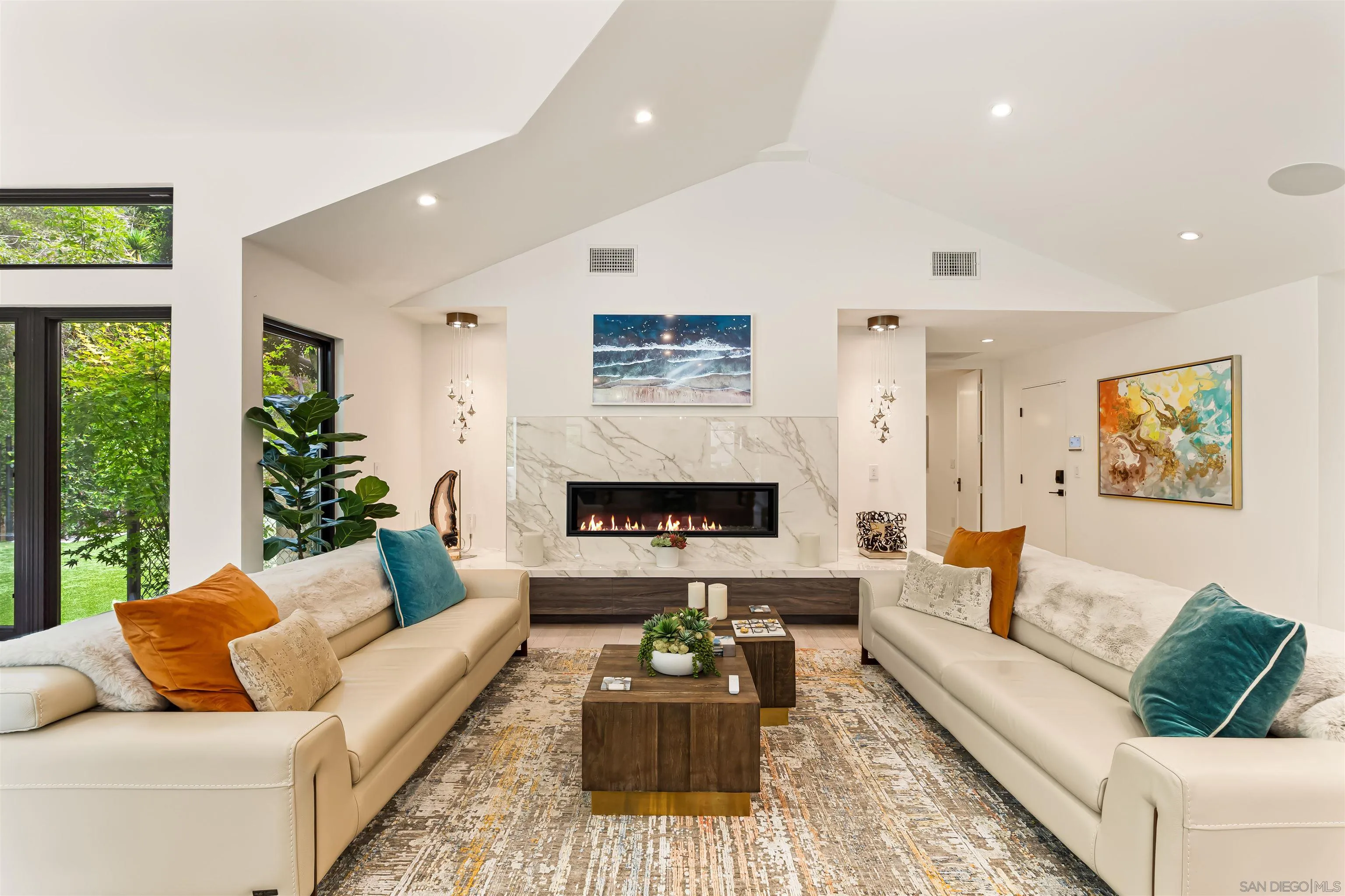 6887 Avenida Andorra La Jolla, CA 92037 - Photo 24 of 75 a living room with furniture and a fireplace