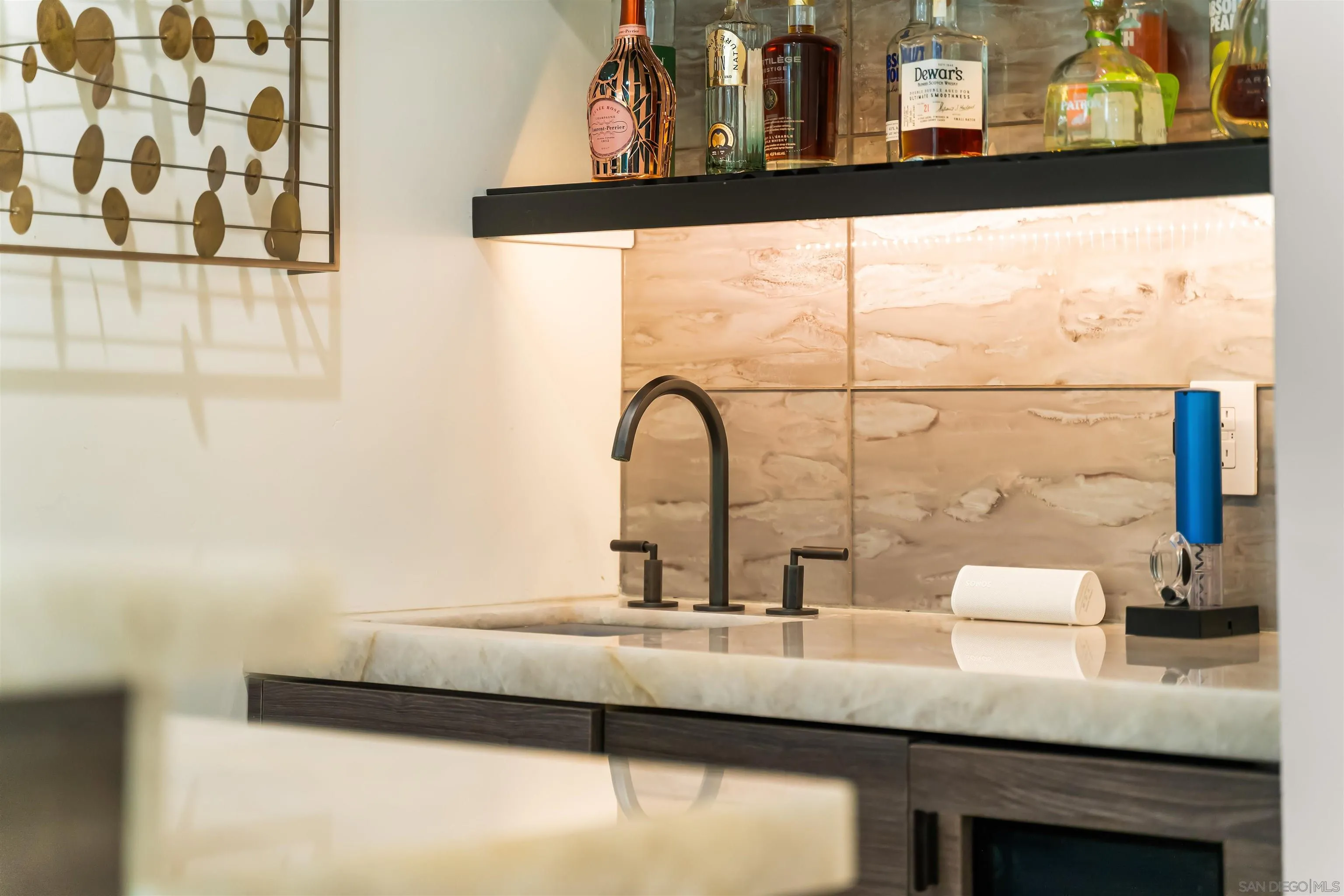 6887 Avenida Andorra La Jolla, CA 92037 - Photo 29 of 75 a bathroom with a sink and a large mirror