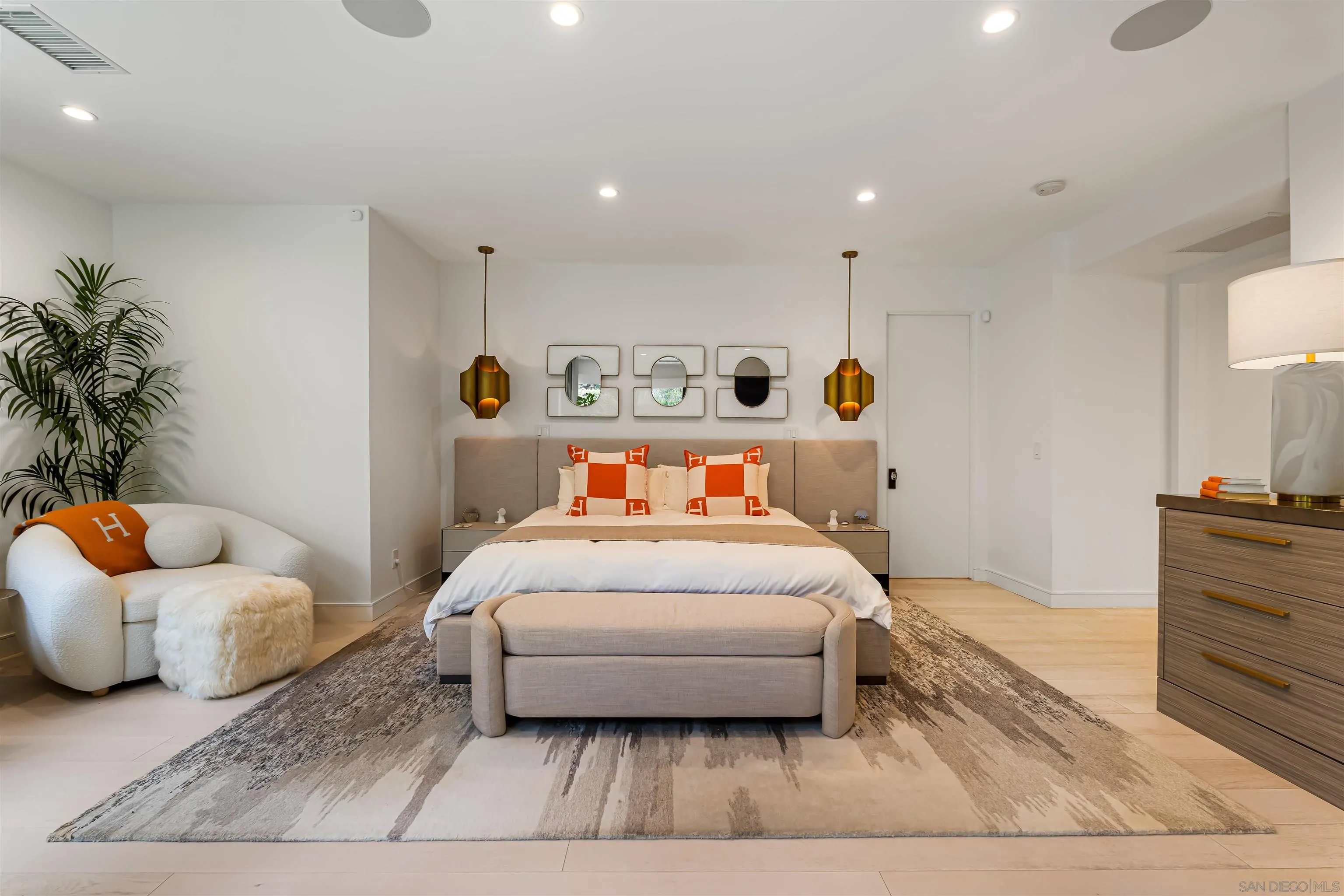 6887 Avenida Andorra La Jolla, CA 92037 - Photo 41 of 75 a bedroom with a bed and a potted plant with wooden floor