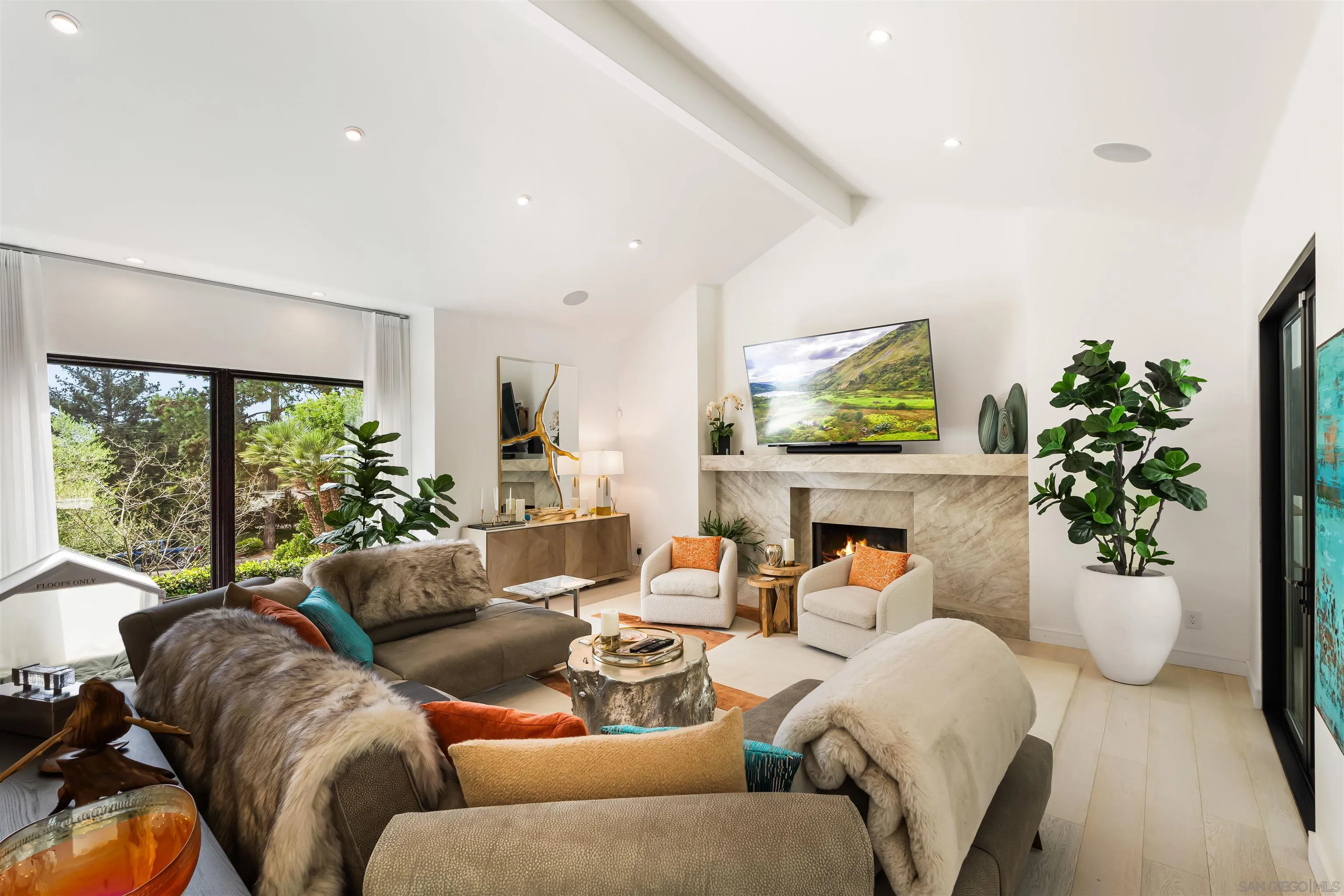 6887 Avenida Andorra La Jolla, CA 92037 - Photo 8 of 75 a living room with furniture potted plant and a large window