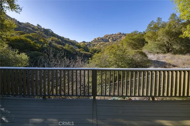 a balcony with wooden floor