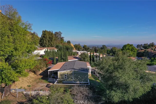 a view of a house with a yard and lake view