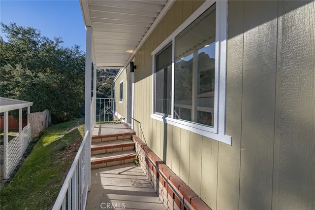 a view of a balcony with door