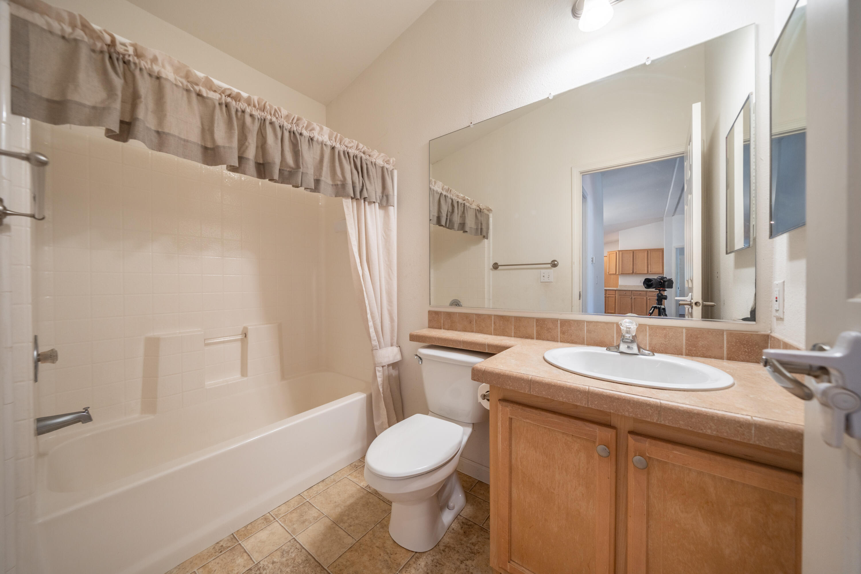 22151 Ravine Court Redding, CA 96003 - Photo 13 of 34 a bathroom with a sink a toilet and shower