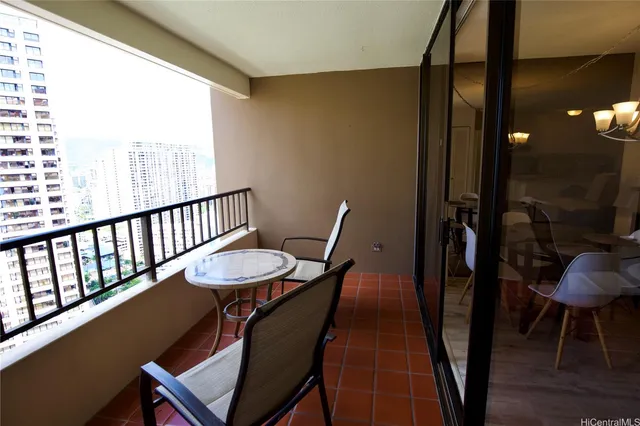 a view of a room with furniture and wooden floor