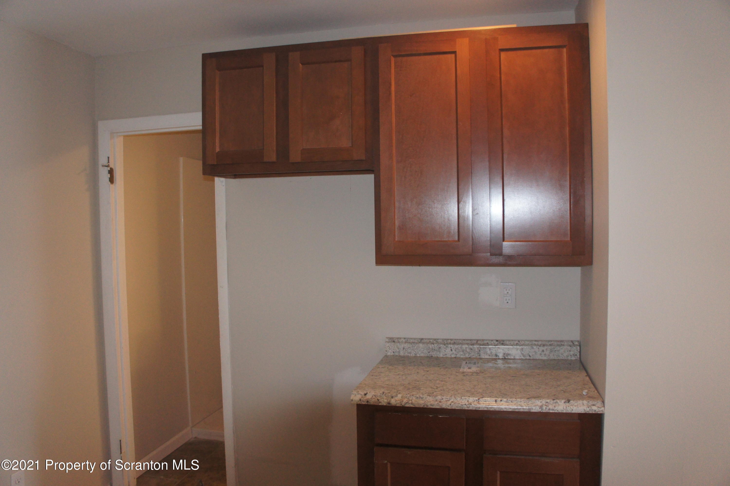 108 North Main Street Scranton, PA 18517 - Photo 13 of 16 a bathroom with a sink and cabinets