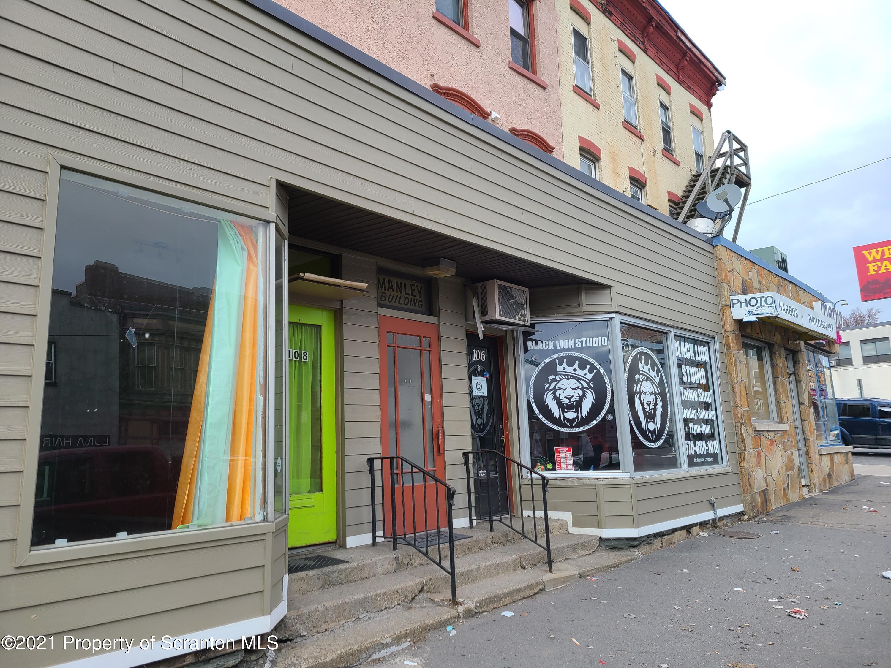108 North Main Street Scranton, PA 18517 - Photo 2 of 16 a sign on a door of a building
