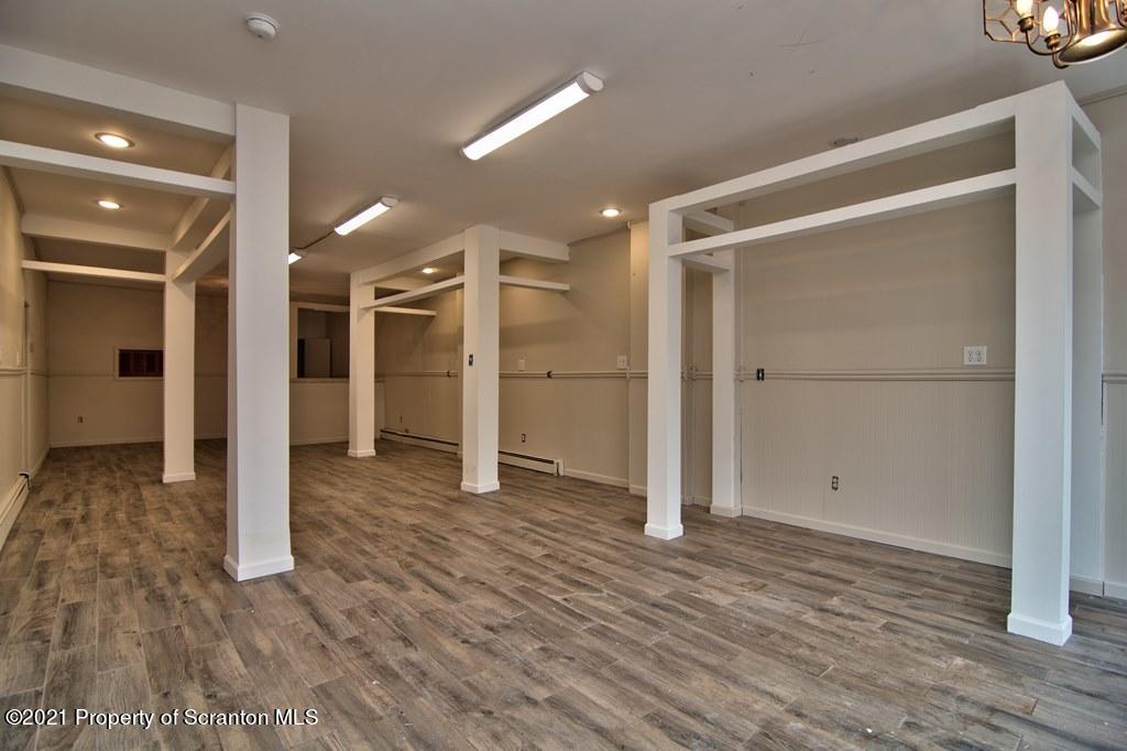 108 North Main Street Scranton, PA 18517 - Photo 5 of 16 a view of empty room with wooden floor and a window