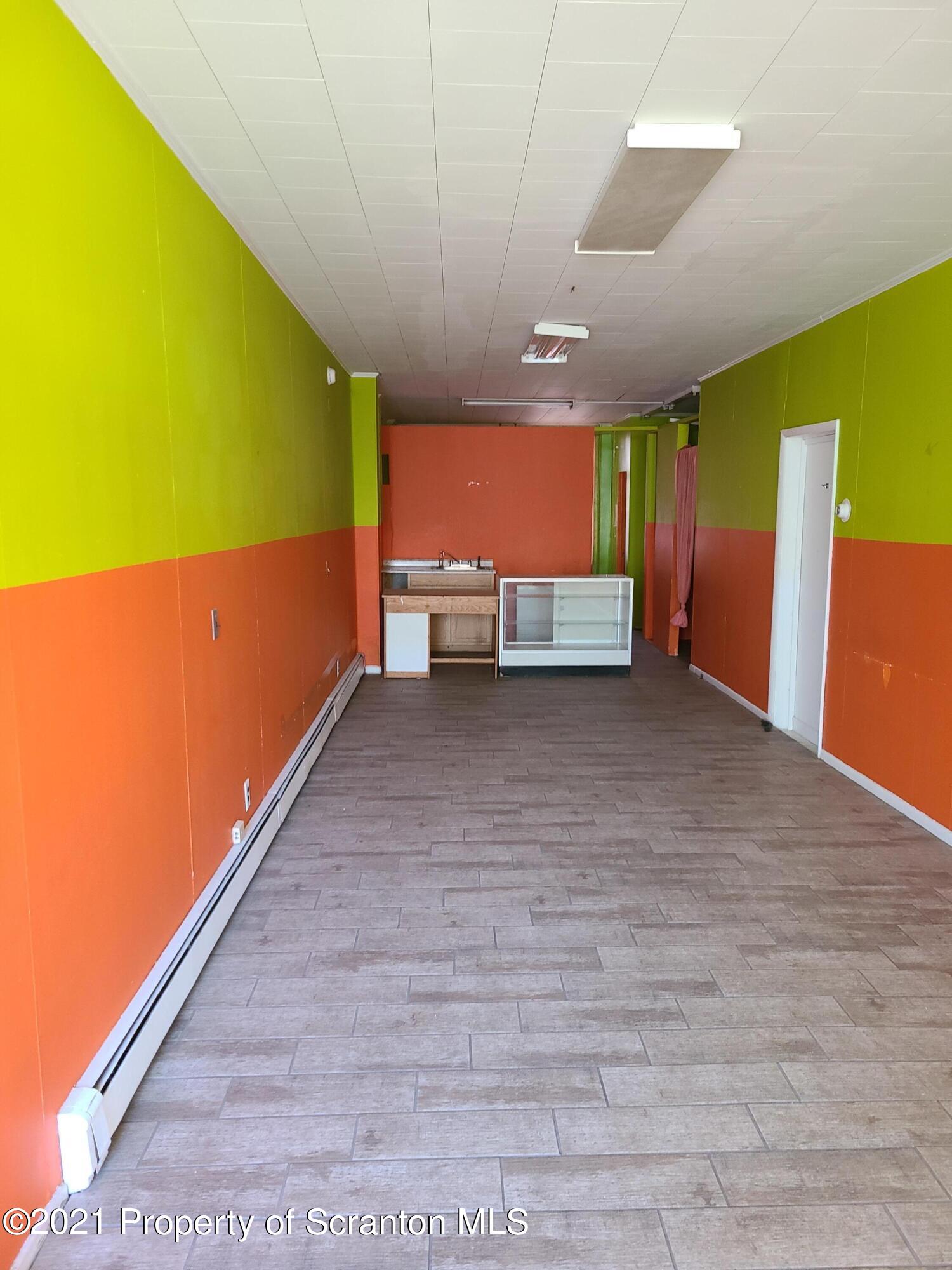 108 North Main Street Scranton, PA 18517 - Photo 7 of 16 a view of an empty room with a window